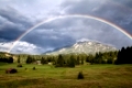 colorful rainbow over Karwendel Alps and meadows, Bavaria, Germany
